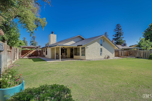 9604 Lea Oak Rd, Bakersfield, CA 93311 - rear view of house featuring a ceiling fan, stucco siding, a chimney, a patio area, and a fenced backyard