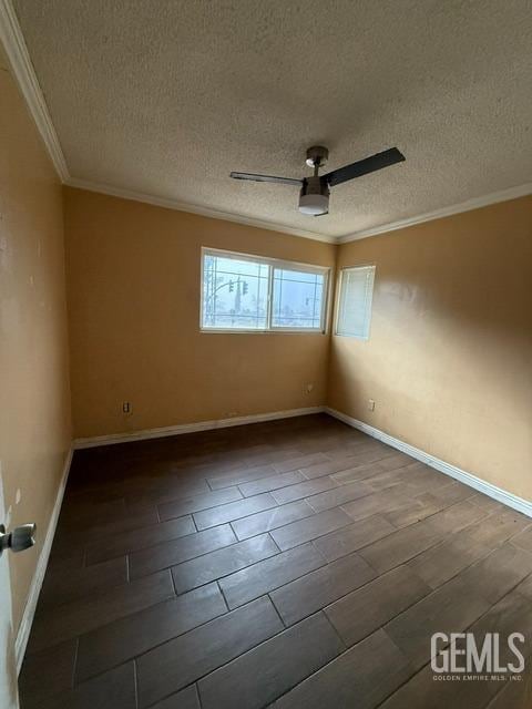 empty room featuring ceiling fan, crown molding, and a textured ceiling