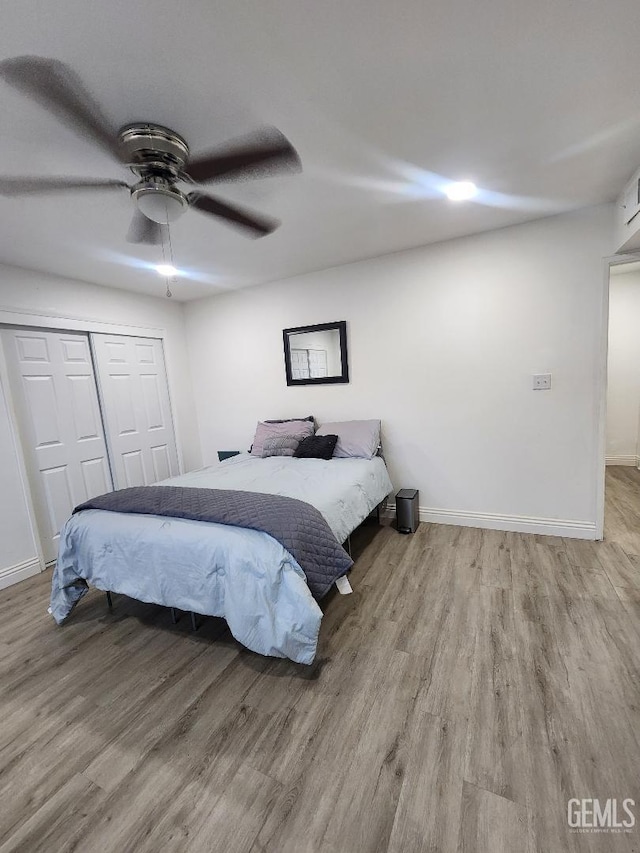 5812 Appletree Ln, Bakersfield, CA 93309 - bedroom with wood finished floors, a closet, and ceiling fan
