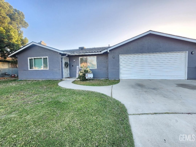 5812 Appletree Ln, Bakersfield, CA 93309 - ranch-style house featuring an attached garage, concrete driveway, stucco siding, and a front yard