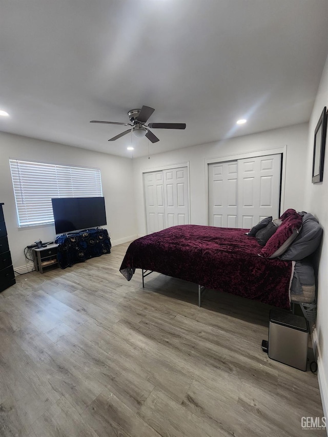 5812 Appletree Ln, Bakersfield, CA 93309 - bedroom featuring two closets, wood finished floors, baseboards, and recessed lighting