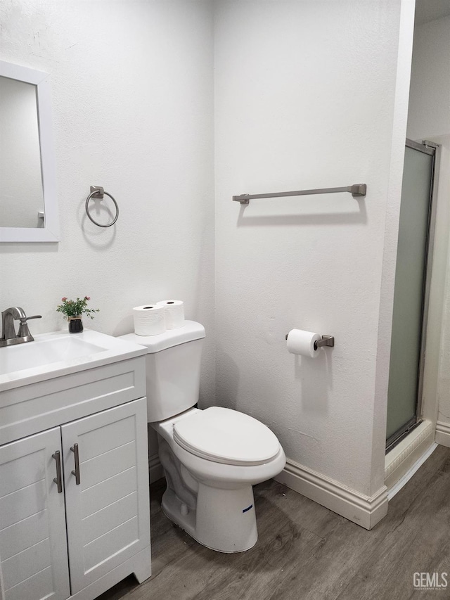 5812 Appletree Ln, Bakersfield, CA 93309 - full bathroom featuring a stall shower, vanity, toilet, and wood finished floors
