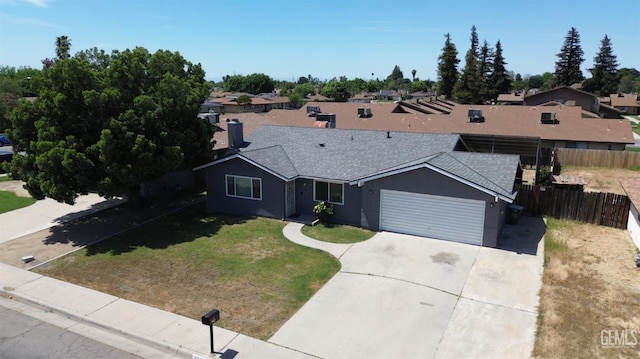 5812 Appletree Ln, Bakersfield, CA 93309 - single story home featuring roof with shingles, an attached garage, concrete driveway, stucco siding, and a residential view