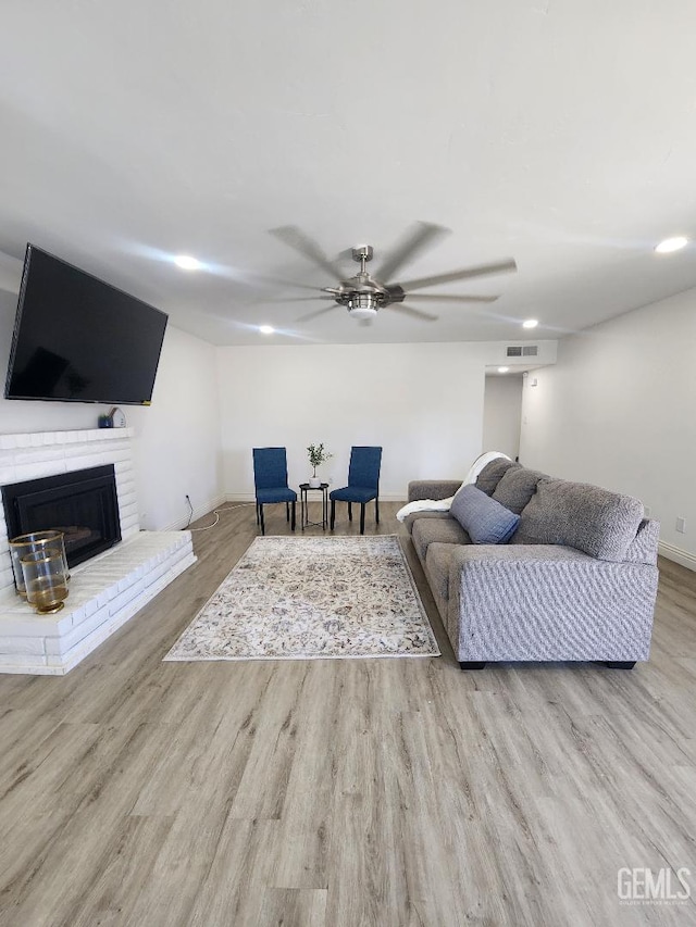 5812 Appletree Ln, Bakersfield, CA 93309 - living room with ceiling fan, wood finished floors, and a fireplace