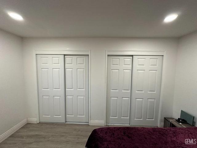 5812 Appletree Ln, Bakersfield, CA 93309 - bedroom featuring two closets, wood finished floors, baseboards, and recessed lighting