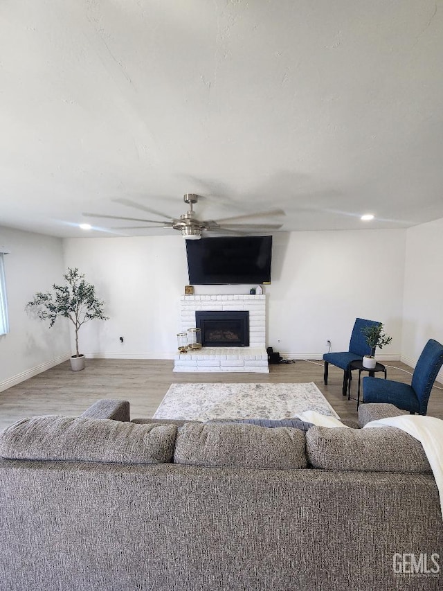 5812 Appletree Ln, Bakersfield, CA 93309 - living room with a ceiling fan, a brick fireplace, wood finished floors, and recessed lighting