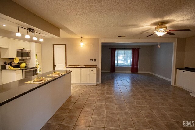 unfurnished living room with a wealth of natural light, french doors, visible vents, and dark wood finished floors