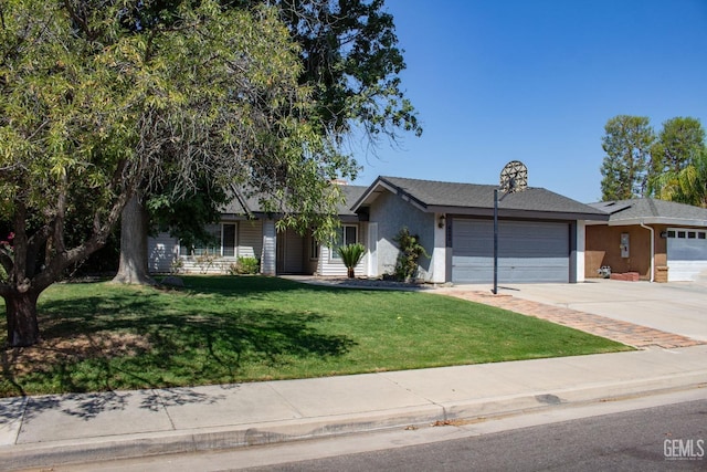 single story home featuring a front yard, driveway, an attached garage, and stucco siding