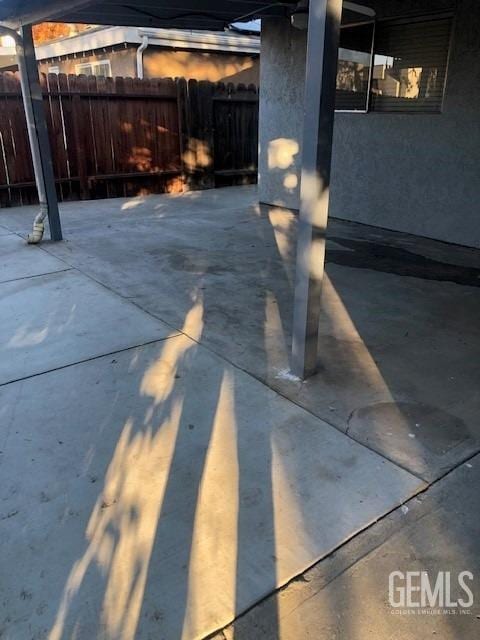 view of patio featuring fence