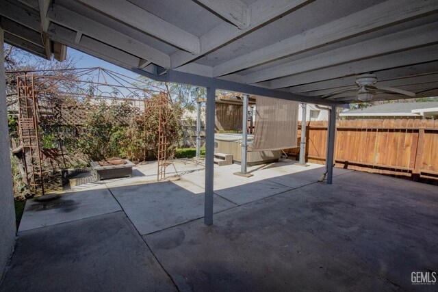 back of property with a patio and stucco siding