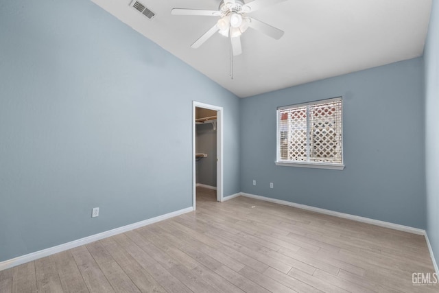 10415 Olympia Fields Dr, Bakersfield, CA 93312 - unfurnished bedroom featuring wood finished floors, vaulted ceiling, a spacious closet, baseboards, and a closet