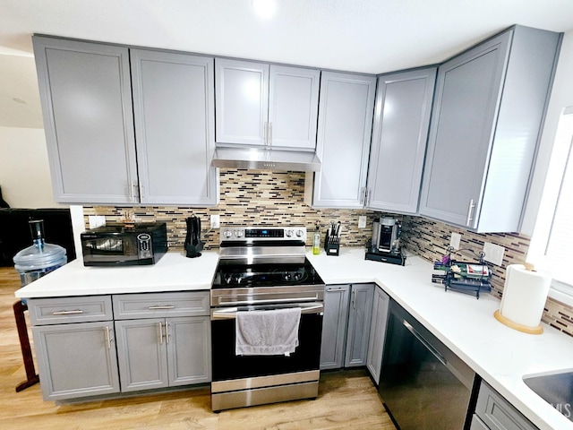 kitchen featuring gray cabinets and stainless steel electric range