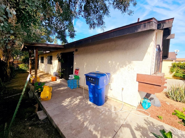 back of property featuring a patio