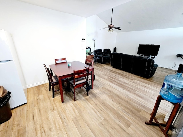 dining area featuring lofted ceiling, light hardwood / wood-style flooring, and ceiling fan