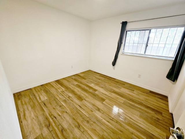 empty room with light wood-type flooring