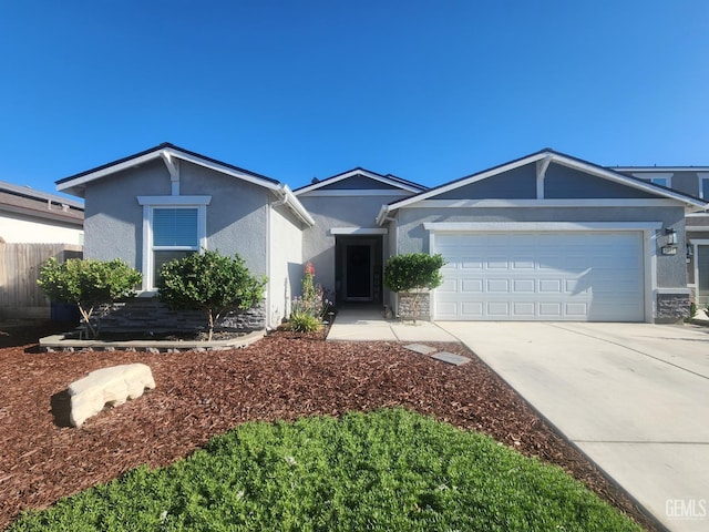 5911 Bogart Dr, Bakersfield, CA 93313 - single story home featuring stucco siding, an attached garage, concrete driveway, and stone siding