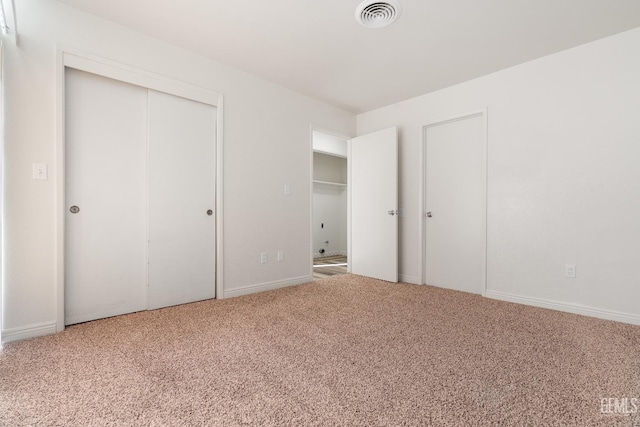 unfurnished bedroom featuring carpet flooring