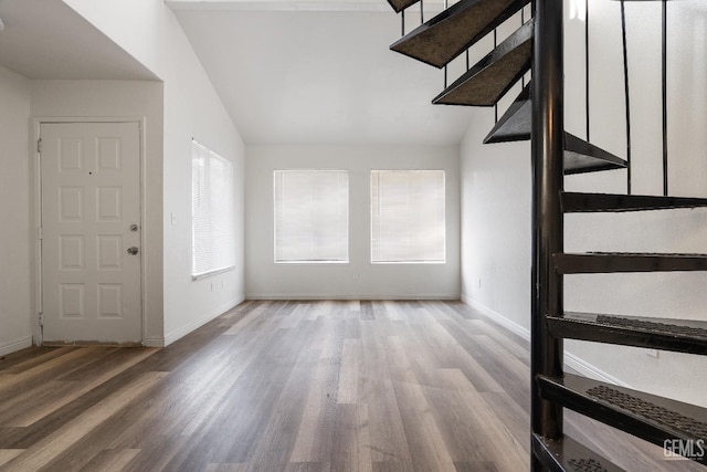 foyer featuring lofted ceiling and light wood-type flooring