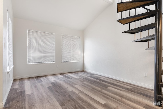 interior space with lofted ceiling and light hardwood / wood-style floors