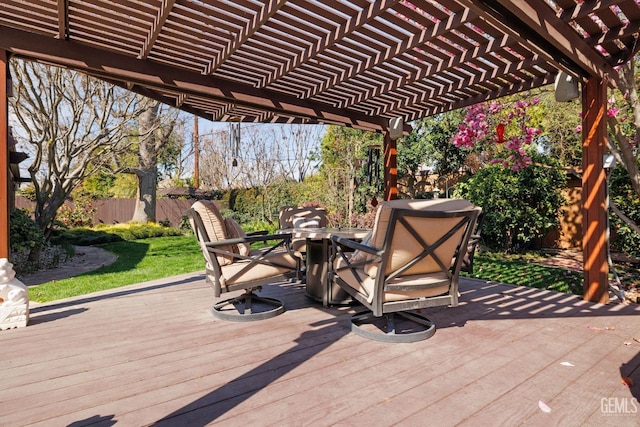 view of patio / terrace with a deck, outdoor dining area, fence, and a pergola