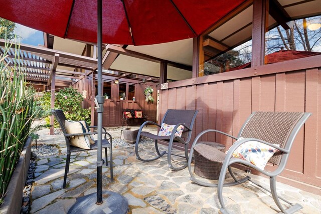 view of patio / terrace featuring fence