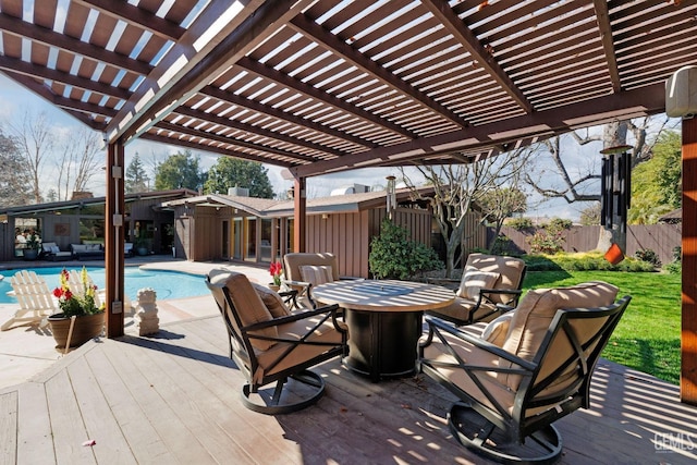 deck with a fenced in pool, fence, and a pergola