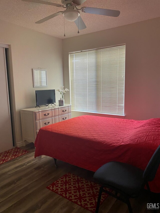 6208 Stonegate Dr, Bakersfield, CA 93306 - bedroom featuring wood finished floors, a textured ceiling, and ceiling fan
