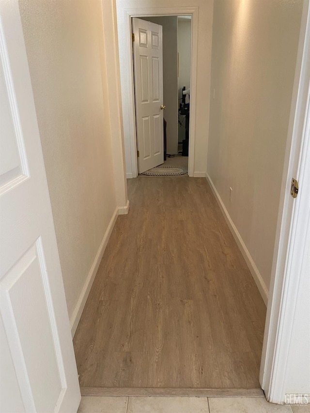 6208 Stonegate Dr, Bakersfield, CA 93306 - hallway featuring wood finished floors and baseboards