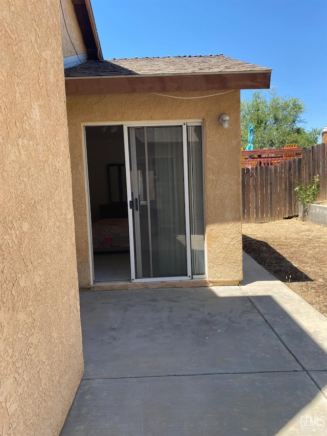 6208 Stonegate Dr, Bakersfield, CA 93306 - view of exterior entry featuring stucco siding and a patio