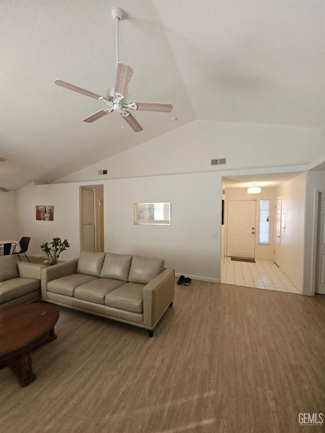 6208 Stonegate Dr, Bakersfield, CA 93306 - living area with lofted ceiling, ceiling fan, and wood finished floors