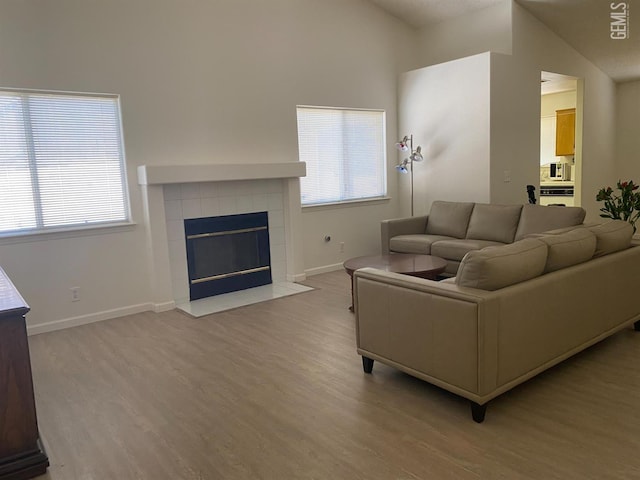 6208 Stonegate Dr, Bakersfield, CA 93306 - living room with wood finished floors and a tiled fireplace