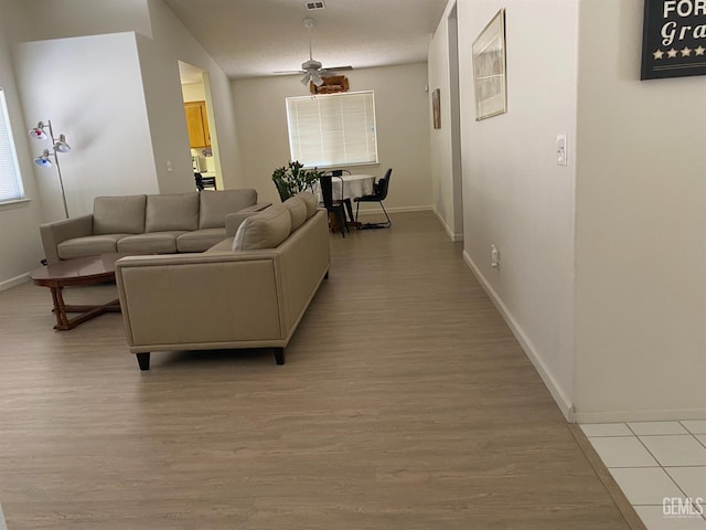 6208 Stonegate Dr, Bakersfield, CA 93306 - living area with light wood finished floors and ceiling fan