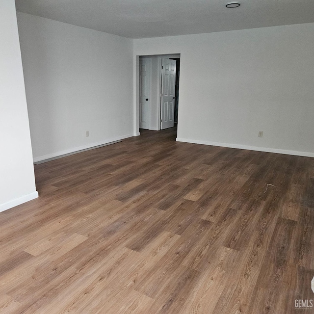 145 T St, Bakersfield, CA 93304 - spare room with wood finished floors and baseboards