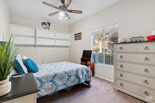 bedroom featuring baseboards, a ceiling fan, and light colored carpet