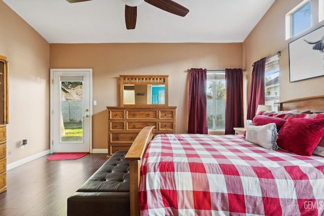 bedroom with dark wood-style floors, access to outside, ceiling fan, and baseboards