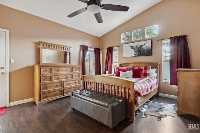 bedroom featuring lofted ceiling, wood finished floors, and baseboards