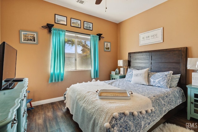 bedroom with visible vents, ceiling fan, baseboards, and wood finished floors