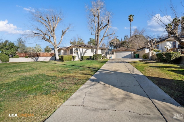 view of front facade with a garage and a front lawn