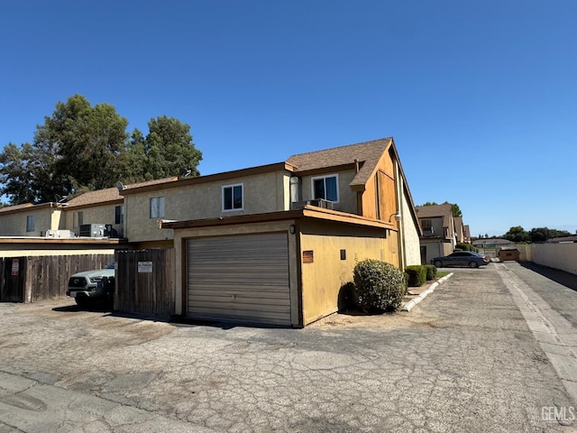 5001 Belle Ter Unit 12, Bakersfield, CA 93309 - view of front facade with an attached garage