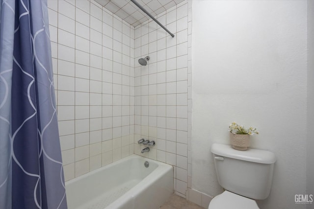 bathroom featuring shower / bath combo and toilet