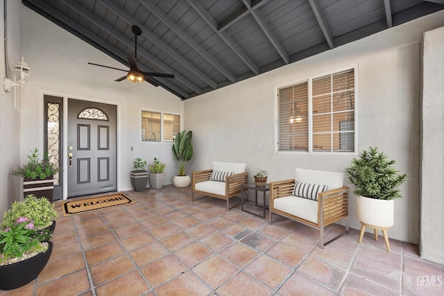 view of patio with ceiling fan and a porch