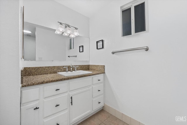 bathroom featuring tile patterned flooring and vanity