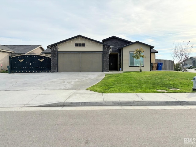 view of front of home with a garage and a front yard