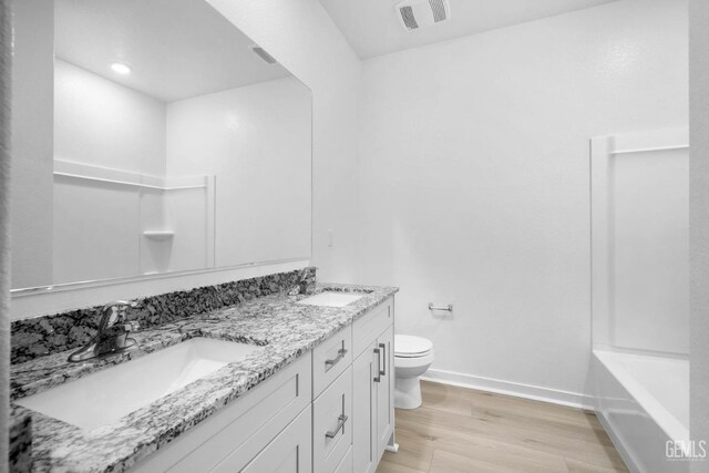 5111 Beaverhead Ave, Bakersfield, CA 93306 - bathroom with wood finished floors, double vanity, and recessed lighting