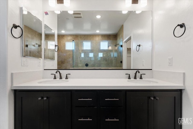 bathroom featuring vanity and a tile shower