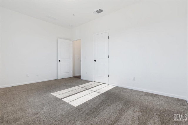 empty room featuring carpet flooring