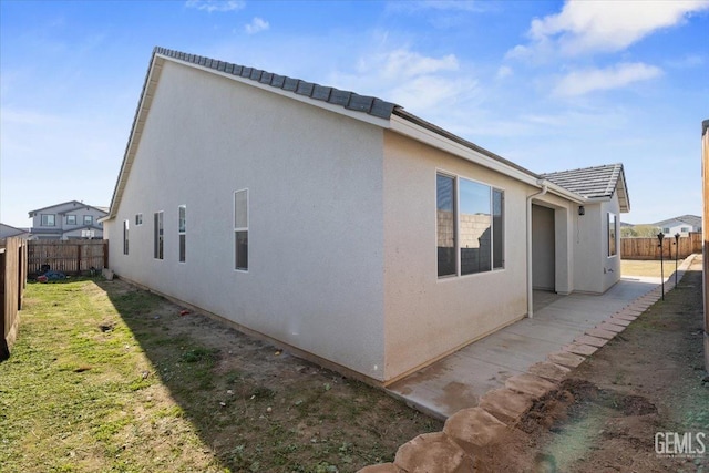 view of side of property with a yard