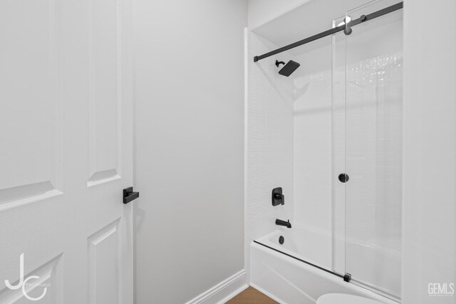 11009 Bright Water Way, Bakersfield, CA 93311 - bathroom with combined bath / shower with glass door, baseboards, and toilet