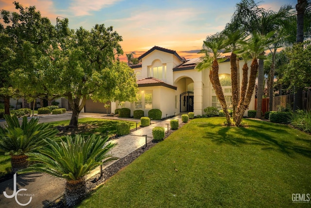 11009 Bright Water Way, Bakersfield, CA 93311 - mediterranean / spanish house with a tiled roof, solar panels, stucco siding, concrete driveway, and an attached garage