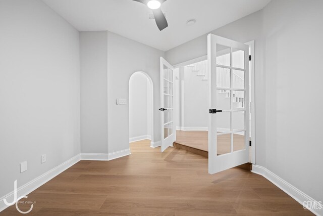 11009 Bright Water Way, Bakersfield, CA 93311 - hall featuring french doors, wood finished floors, and baseboards